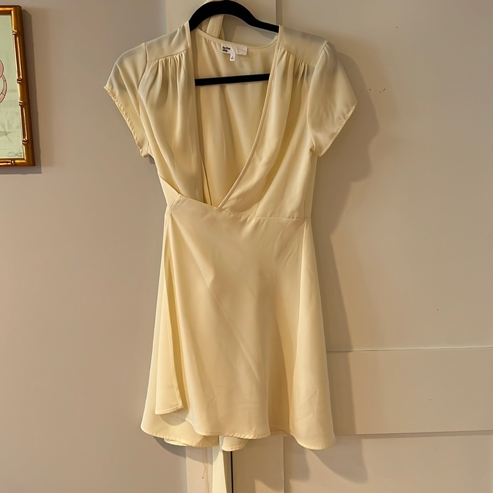 Mini light yellow wrap dress from Revolve